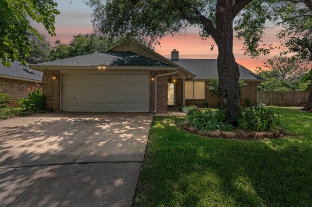9013 Topperwind Ct, Fort Worth, TX 76134 - view of front facade with brick siding, driveway, an attached garage, a chimney, and a shingled roof