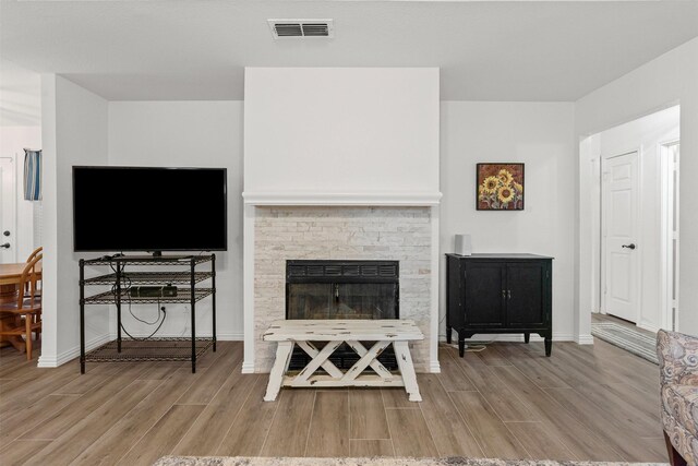 9013 Topperwind Ct, Fort Worth, TX 76134 - living area featuring wood finished floors and a fireplace