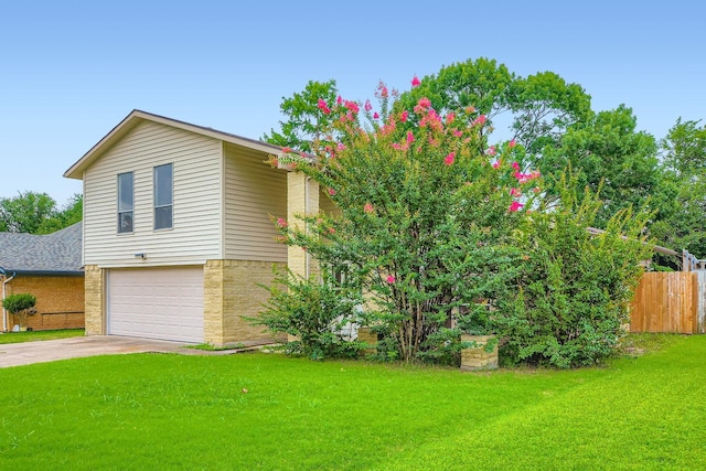 902 Via Valencia, Mesquite, TX 75150 - view of front facade with an attached garage, driveway, and brick siding