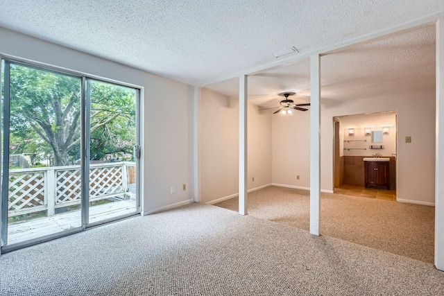 902 Via Valencia, Mesquite, TX 75150 - unfurnished bedroom with access to outside, carpet flooring, a textured ceiling, and ensuite bathroom