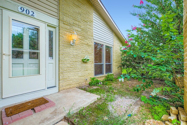 902 Via Valencia, Mesquite, TX 75150 - doorway to property featuring brick siding