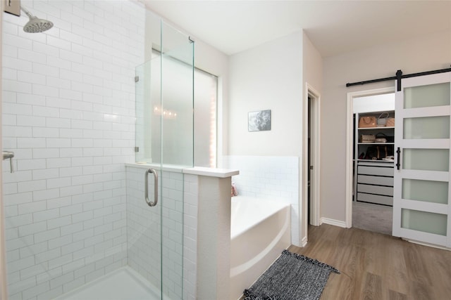 12720 Outlook Ave, Fort Worth, TX 76244 - full bath with wood finished floors, a stall shower, and a garden tub
