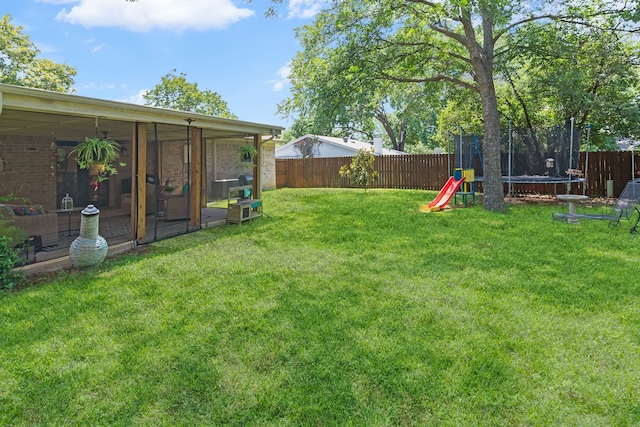 5807 Shady Hill Ln, Arlington, TX 76016 - fenced backyard featuring a trampoline and a sunroom
