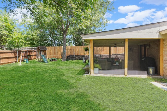 5807 Shady Hill Ln, Arlington, TX 76016 - fenced backyard featuring a sunroom and a playground