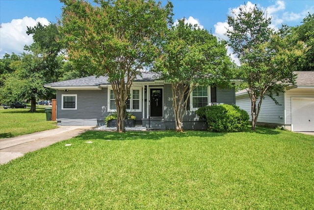 315 N Mckown Ave, Sherman, TX 75092 - view of front of house featuring a front yard and an attached garage