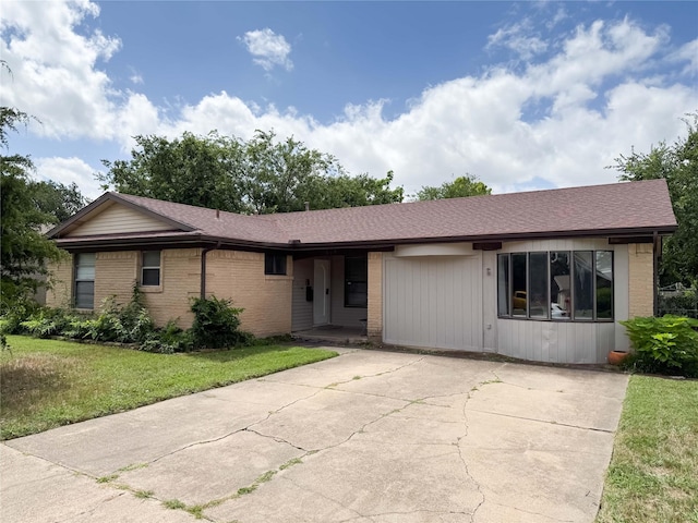 509 Cambridge, Richardson, TX 75080 - ranch-style home featuring brick siding, a front lawn, driveway, and a shingled roof