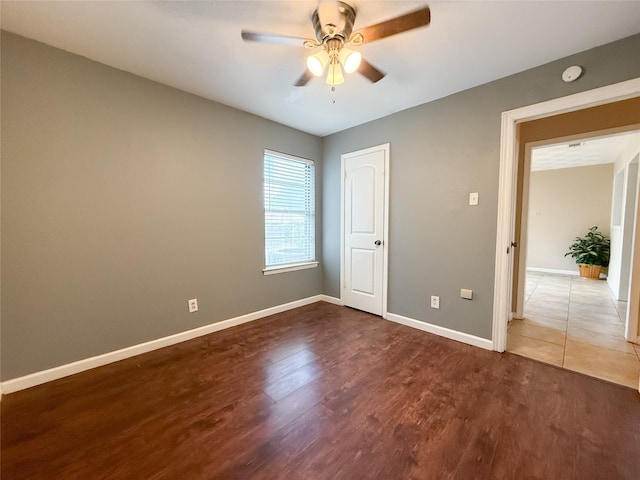 509 Cambridge, Richardson, TX 75080 - unfurnished bedroom with wood finished floors and ceiling fan