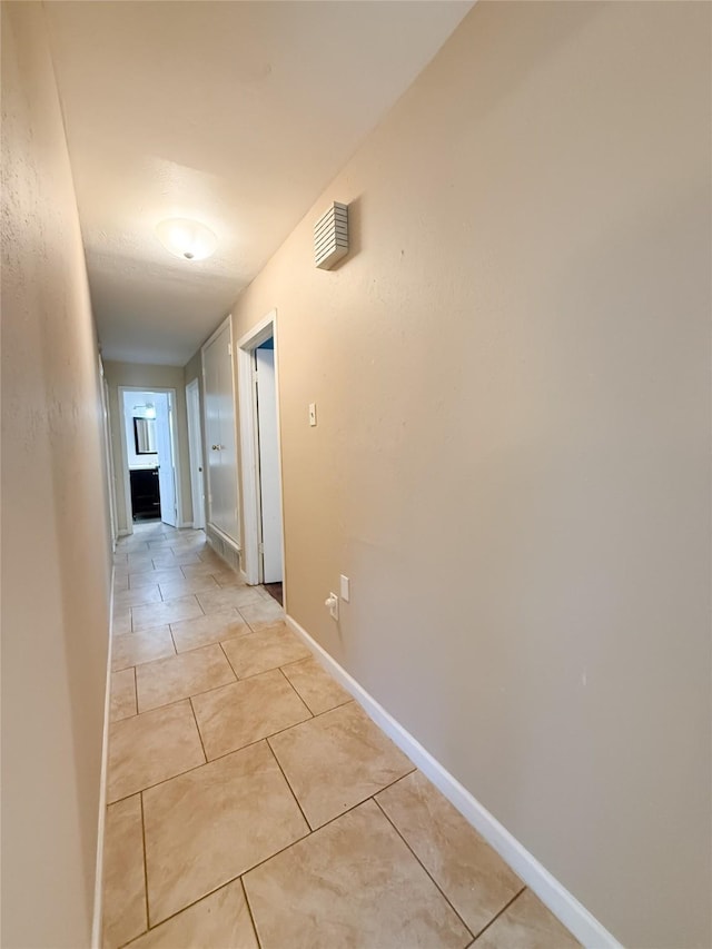 509 Cambridge, Richardson, TX 75080 - hallway with light tile patterned floors and baseboards