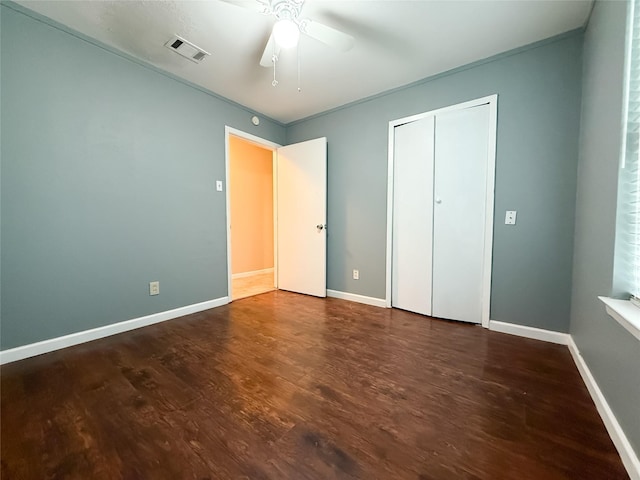 509 Cambridge, Richardson, TX 75080 - unfurnished bedroom with wood finished floors, a closet, and a ceiling fan