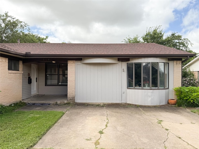 509 Cambridge, Richardson, TX 75080 - doorway to property with roof with shingles