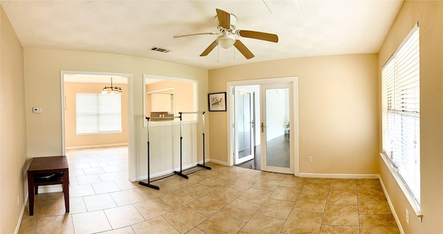 509 Cambridge, Richardson, TX 75080 - empty room featuring ceiling fan, healthy amount of natural light, and light tile patterned floors
