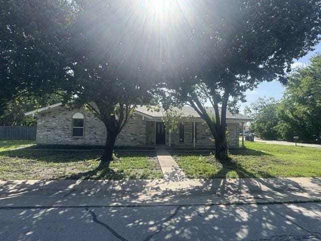1004 N 4th St, Princeton, TX 75407 - obstructed view of property with stone siding