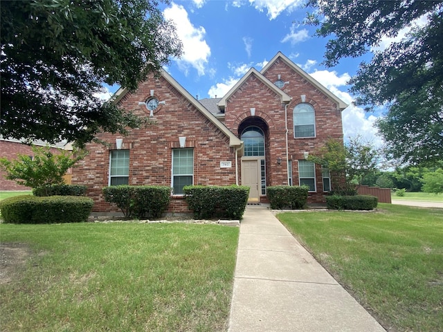 740 Bridgeport Ln, Prosper, TX 75078 - traditional-style house with brick siding and a front lawn