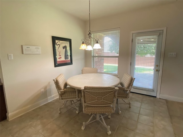 740 Bridgeport Ln, Prosper, TX 75078 - dining area featuring light tile patterned flooring and a chandelier