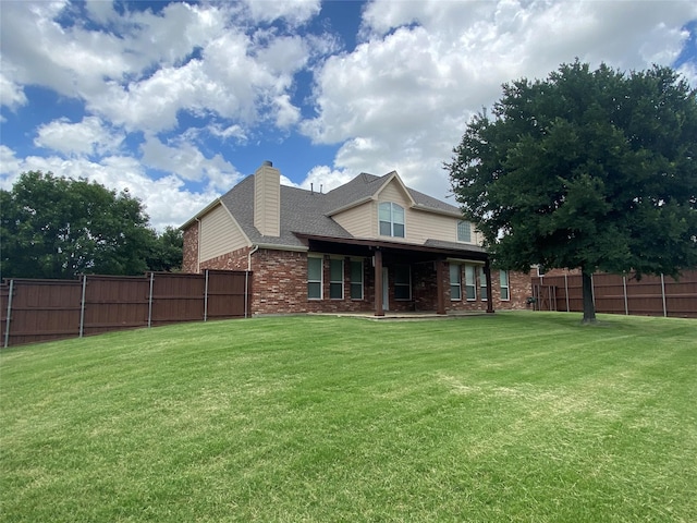 740 Bridgeport Ln, Prosper, TX 75078 - back of property featuring brick siding, a chimney, and a shingled roof