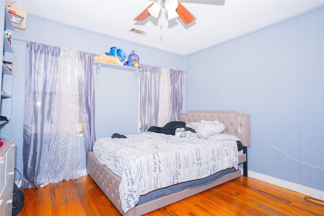 1443 Irene Ave, Lancaster, TX 75134 - bedroom with wood-type flooring and ceiling fan