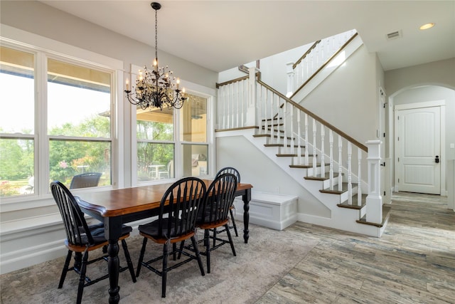 100 Redtail Hawk Dr, Aledo, TX 76008 - dining room with plenty of natural light, arched walkways, wood finished floors, and stairway