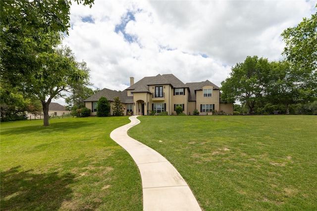 100 Redtail Hawk Dr, Aledo, TX 76008 - view of front facade with stucco siding, a front lawn, and a chimney