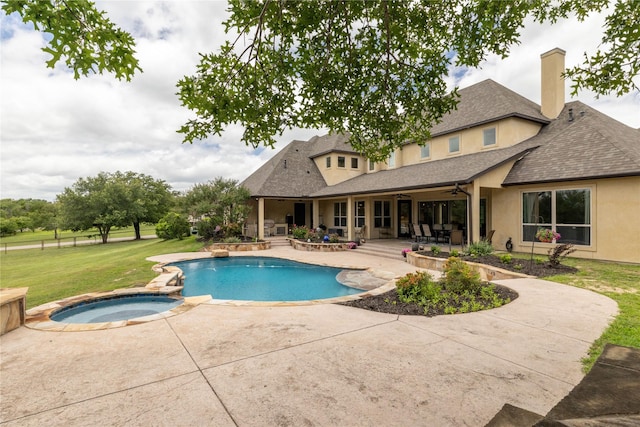 100 Redtail Hawk Dr, Aledo, TX 76008 - view of swimming pool featuring a ceiling fan, a patio area, a lawn, and a pool with connected hot tub