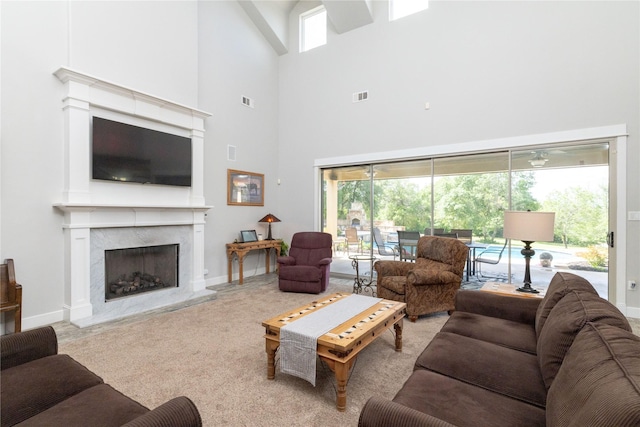 100 Redtail Hawk Dr, Aledo, TX 76008 - living area featuring a high ceiling, a premium fireplace, and carpet floors