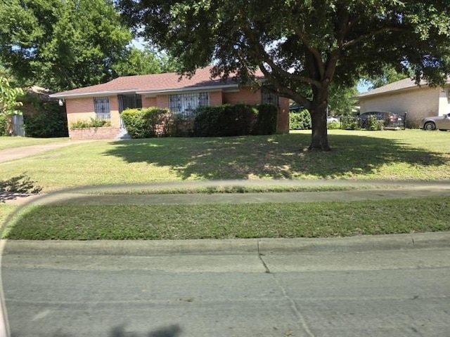 3916 Kushla Ave, Dallas, TX 75216 - single story home with a front yard and brick siding
