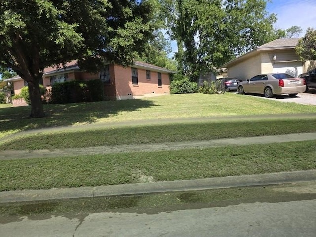 3916 Kushla Ave, Dallas, TX 75216 - view of grassy yard featuring an attached garage