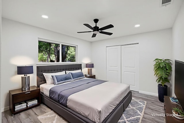 6401 Simmons Rd, North Richland Hills, TX 76182 - bedroom featuring wood finished floors, recessed lighting, a closet, and a ceiling fan