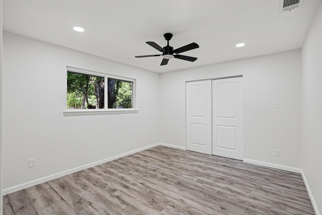 6401 Simmons Rd, North Richland Hills, TX 76182 - unfurnished bedroom featuring wood finished floors, recessed lighting, a closet, and a ceiling fan