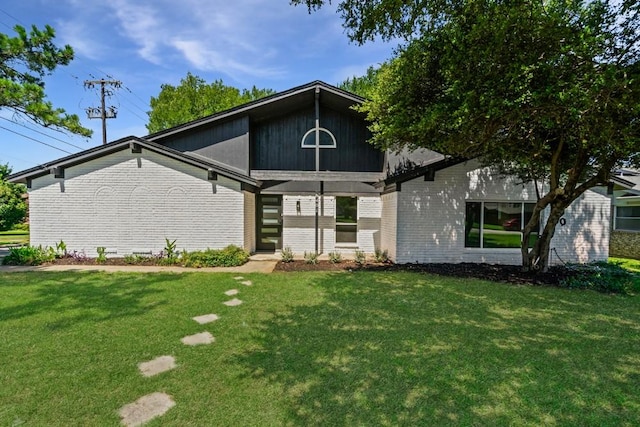 6401 Simmons Rd, North Richland Hills, TX 76182 - view of front facade featuring brick siding and a front yard