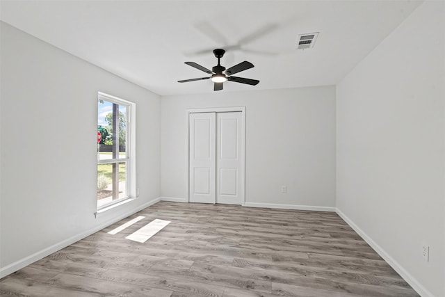 6401 Simmons Rd, North Richland Hills, TX 76182 - unfurnished bedroom featuring wood finished floors, a closet, and ceiling fan