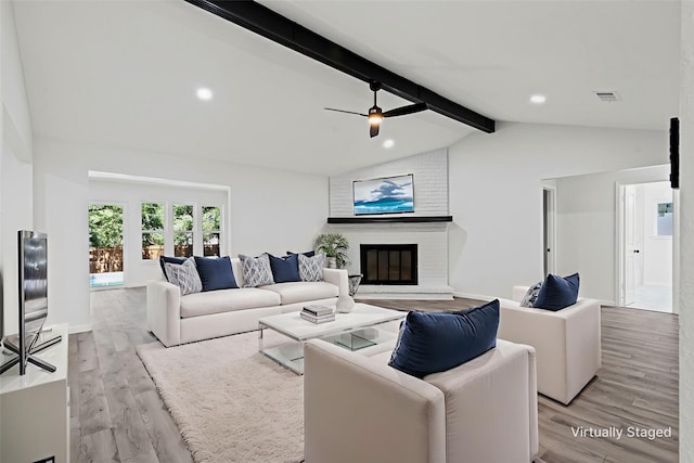 6401 Simmons Rd, North Richland Hills, TX 76182 - living room featuring light wood-type flooring, a brick fireplace, and recessed lighting