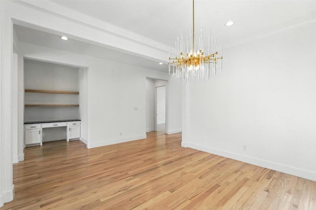 13868 Dorset Ln, Frisco, TX 75035 - spare room featuring a chandelier, light wood-style floors, recessed lighting, and built in desk