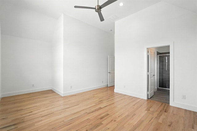 13868 Dorset Ln, Frisco, TX 75035 - unfurnished bedroom with light wood finished floors, high vaulted ceiling, recessed lighting, and connected bathroom