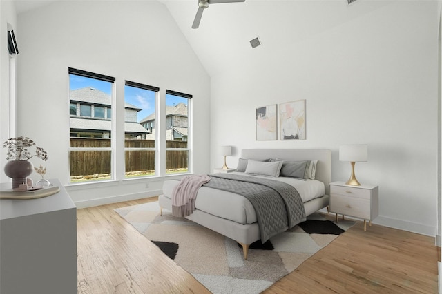 13868 Dorset Ln, Frisco, TX 75035 - bedroom featuring high vaulted ceiling, light wood finished floors, and a ceiling fan