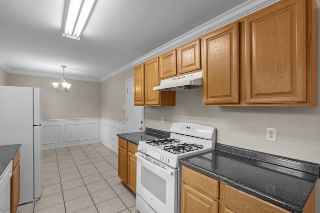 5308 Wentworth St, Fort Worth, TX 76132 - kitchen with white appliances, under cabinet range hood, crown molding, a chandelier, and light tile patterned floors