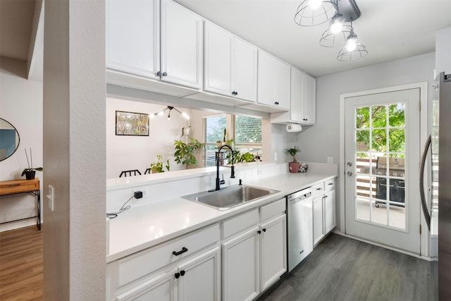8805 Tumbleweed Dr, Cross Roads, TX 76227 - kitchen featuring stainless steel dishwasher, dark wood-type flooring, fridge, light countertops, and white cabinets