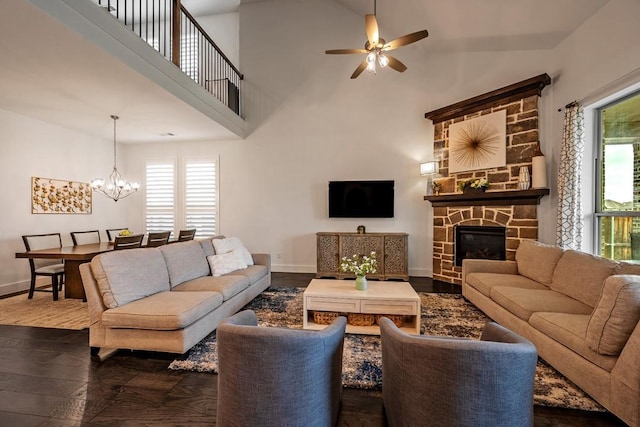 778 Corner Post Path, Celina, TX 75009 - living area featuring dark wood-type flooring, a ceiling fan, a chandelier, a fireplace, and high vaulted ceiling
