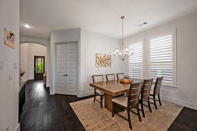 778 Corner Post Path, Celina, TX 75009 - dining space with arched walkways, dark wood finished floors, a chandelier, and recessed lighting