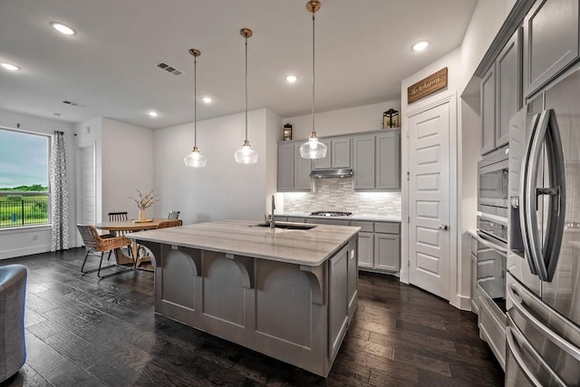 778 Corner Post Path, Celina, TX 75009 - kitchen featuring stainless steel appliances, gray cabinetry, a kitchen island with sink, tasteful backsplash, and recessed lighting