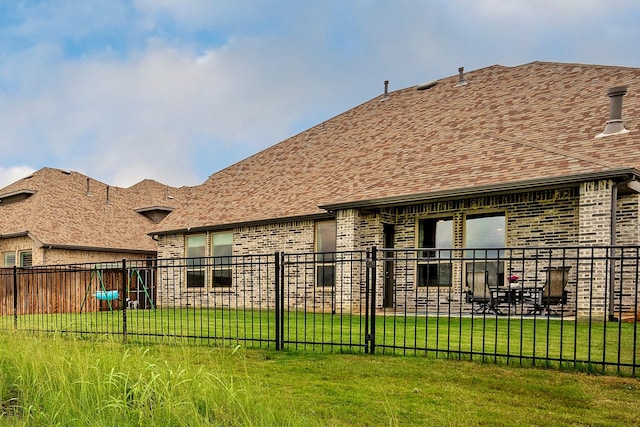778 Corner Post Path, Celina, TX 75009 - back of property with brick siding and a shingled roof