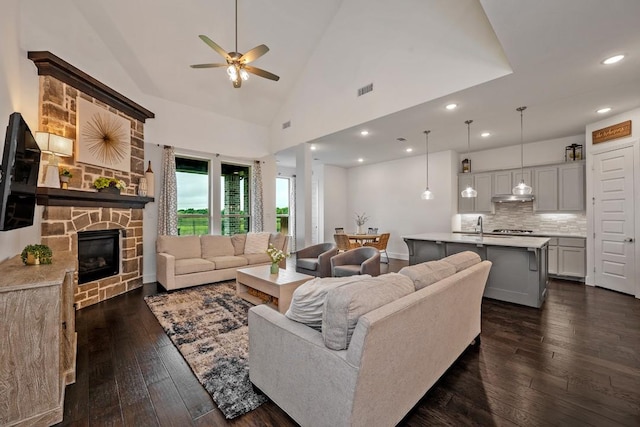 778 Corner Post Path, Celina, TX 75009 - living area featuring a ceiling fan, dark wood finished floors, recessed lighting, a fireplace, and high vaulted ceiling