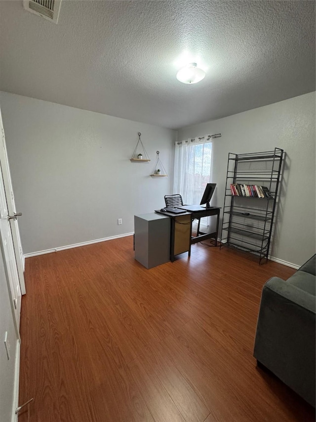 2100 Leandra Ln, Fort Worth, TX 76131 - office featuring wood finished floors and a textured ceiling