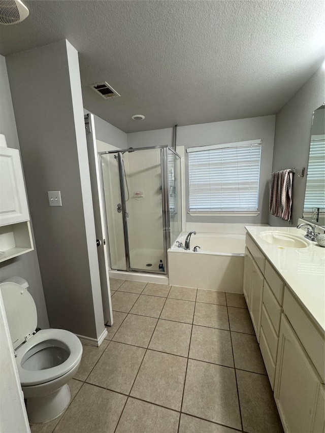 2100 Leandra Ln, Fort Worth, TX 76131 - bathroom featuring vanity, a garden tub, a shower stall, a textured ceiling, and tile patterned flooring