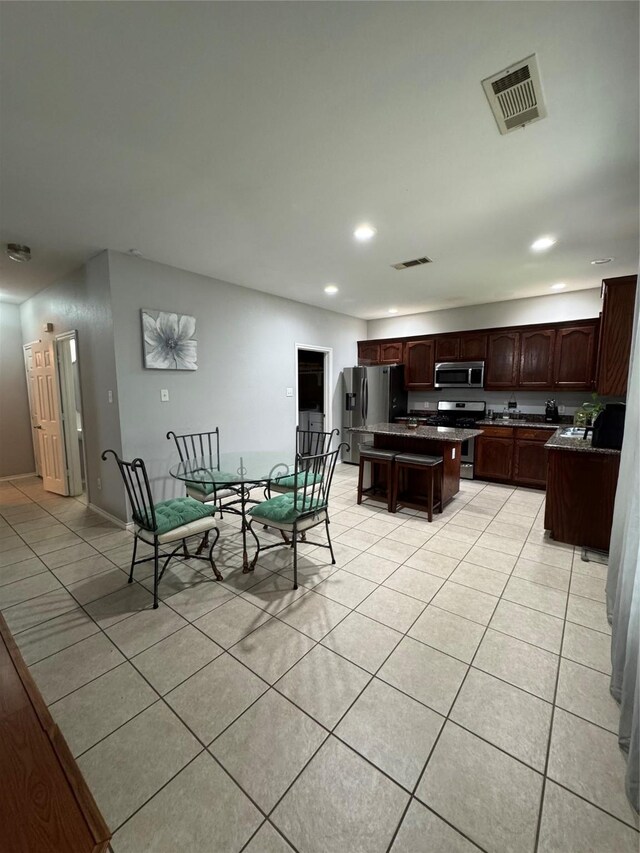 2100 Leandra Ln, Fort Worth, TX 76131 - dining space with light tile patterned floors and recessed lighting