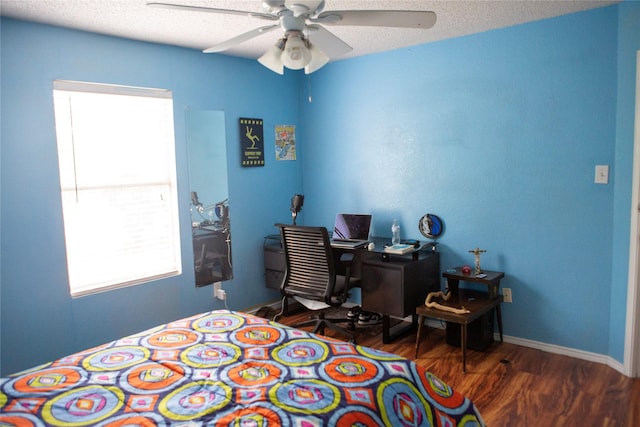 1313 Forbes Dr, Garland, TX 75040 - bedroom with wood finished floors, multiple windows, and ceiling fan