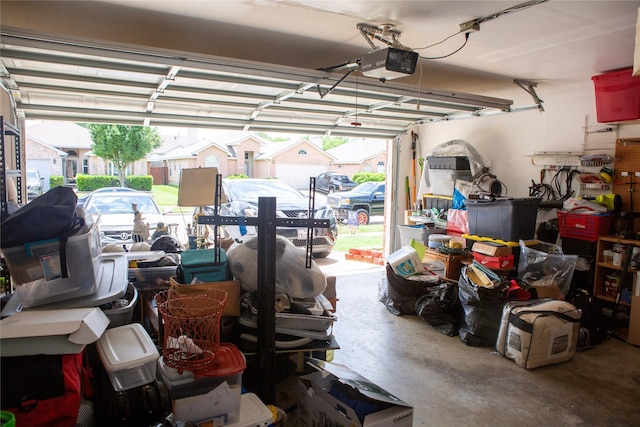 1313 Forbes Dr, Garland, TX 75040 - garage featuring a garage door opener