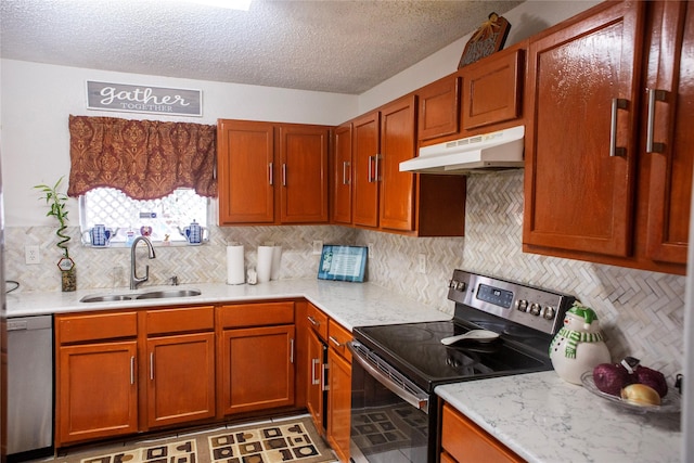 1313 Forbes Dr, Garland, TX 75040 - kitchen featuring appliances with stainless steel finishes, under cabinet range hood, a textured ceiling, backsplash, and brown cabinetry