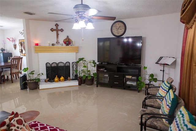 1313 Forbes Dr, Garland, TX 75040 - tiled living room featuring ceiling fan and a fireplace