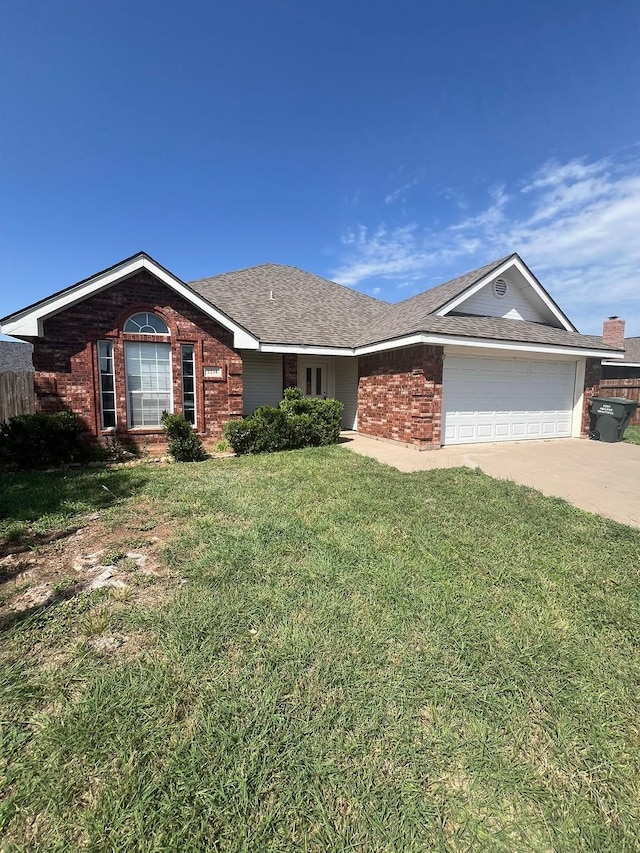 2234 Patriot Commons Rd, Abilene, TX 79601 - ranch-style house with a garage, brick siding, a front yard, concrete driveway, and a shingled roof