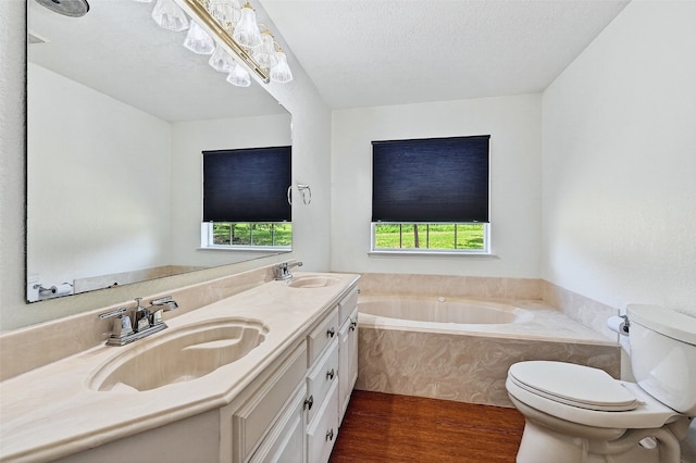 2107 Meadows Cir, Sherman, TX 75092 - bathroom featuring wood finished floors, a bath, and double vanity